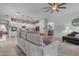 Open-concept living room and kitchen area with modern tile flooring at 22639 E Avenida Del Valle --, Queen Creek, AZ 85142