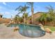 Backyard pool features a waterfall, decorative rocks, and lush landscaping at 22639 E Avenida Del Valle --, Queen Creek, AZ 85142