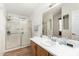 Clean bathroom features a vanity with sink, mirror, and glass enclosed shower at 2400 E Baseline Ave # 169, Apache Junction, AZ 85119