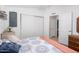 Simple bedroom featuring a comfortable bed and sliding closet doors at 2400 E Baseline Ave # 169, Apache Junction, AZ 85119