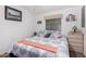 Cozy bedroom featuring a comfortable bed, window, and white walls at 2400 E Baseline Ave # 169, Apache Junction, AZ 85119