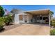 Inviting single-story home with a covered carport and well-maintained landscaping, offering comfort and convenience at 2400 E Baseline Ave # 169, Apache Junction, AZ 85119