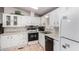 Bright kitchen featuring all white cabinets, modern appliances, and a functional layout perfect for cooking at 2400 E Baseline Ave # 169, Apache Junction, AZ 85119