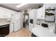 Efficient kitchen with white cabinetry, modern appliances, and a cozy breakfast nook area with natural light at 2400 E Baseline Ave # 169, Apache Junction, AZ 85119