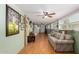 Spacious living room with a sofa, multiple windows, and ceiling fans at 2400 E Baseline Ave # 169, Apache Junction, AZ 85119