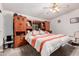 Cozy main bedroom with a ceiling fan, comfortable bed, and a built-in unit at 2400 E Baseline Ave # 169, Apache Junction, AZ 85119