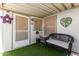 Cozy porch with an outdoor bench and a door to the outside at 2400 E Baseline Ave # 169, Apache Junction, AZ 85119