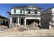 New two-story home under construction, featuring a modern design and sturdy framework at 24268 W Pecan Rd, Buckeye, AZ 85326