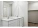 Bathroom vanity features double sinks, white cabinets, and a large mirror at 25484 W Graham Trl, Buckeye, AZ 85326