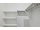 Walk-in closet with shelving and metal rods at 25484 W Graham Trl, Buckeye, AZ 85326