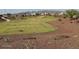 Expansive community park with lush lawns, walking paths, and recreational facilities in the distance at 25484 W Graham Trl, Buckeye, AZ 85326