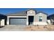 Charming single-story home featuring a well-manicured lawn, neutral paint scheme, and a two-car garage at 25484 W Graham Trl, Buckeye, AZ 85326