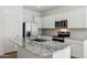 Kitchen with stainless steel appliances and granite countertops at 25484 W Graham Trl, Buckeye, AZ 85326