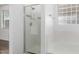 Bright bathroom showcasing a shower and tub, with glass block window providing natural light and privacy at 28232 N Abby Cir, San Tan Valley, AZ 85143