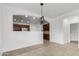 View of the dining room showing tiled floor and decorative light fixture at 28232 N Abby Cir, San Tan Valley, AZ 85143