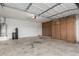 An organized garage offers ample storage with built-in cabinets and space for vehicles and equipment at 28232 N Abby Cir, San Tan Valley, AZ 85143