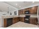The kitchen features wooden cabinets, granite countertops, and modern appliances at 28232 N Abby Cir, San Tan Valley, AZ 85143