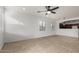 The open-concept living room has tiled floors and large windows at 28232 N Abby Cir, San Tan Valley, AZ 85143
