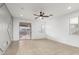 The living room features a ceiling fan, recessed lighting, and sliding glass door leading to the back yard at 28232 N Abby Cir, San Tan Valley, AZ 85143
