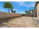 A spacious dirt backyard with a block wall and potential for landscaping and outdoor activities at 30100 N Sunray Dr, San Tan Valley, AZ 85143