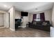 Versatile bonus room with a comfortable couch and desk area at 30100 N Sunray Dr, San Tan Valley, AZ 85143
