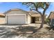 Charming single-story home featuring a two car garage and mature landscaping at 30100 N Sunray Dr, San Tan Valley, AZ 85143