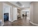 Bright hallway with wood-look tile leading to various rooms in the home at 30100 N Sunray Dr, San Tan Valley, AZ 85143