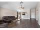 Open-concept living room with vaulted ceiling and updated wood-look tile flooring at 30100 N Sunray Dr, San Tan Valley, AZ 85143