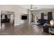 Inviting living area with wood-look tile and large windows, seamlessly flowing layout at 30100 N Sunray Dr, San Tan Valley, AZ 85143
