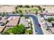 Lovely aerial view of a home featuring mature landscaping, sidewalks, and easy access to a neighborhood green belt at 30285 W Leah Dr, Buckeye, AZ 85396