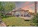 Lush backyard featuring a seating area, privacy wall and mature landscaping, perfect for entertaining or relaxing at 30285 W Leah Dr, Buckeye, AZ 85396
