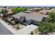 Beautiful single-story home featuring a tile roof, desert landscaping, and a two-car garage at 30285 W Leah Dr, Buckeye, AZ 85396