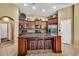 Well-equipped kitchen with granite countertops, stainless steel appliances, a center island and bar stool seating at 30285 W Leah Dr, Buckeye, AZ 85396