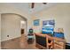 An office area featuring a vintage barber chair, archway, and a glimpse into the bathroom at 30285 W Leah Dr, Buckeye, AZ 85396