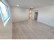 Bright room features recessed lighting and modern vinyl floors at 3208 W Bloomfield Rd, Phoenix, AZ 85029