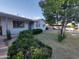 Inviting home exterior with well-manicured shrubbery and a mature tree in the front yard at 3208 W Bloomfield Rd, Phoenix, AZ 85029