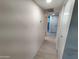 Hallway view featuring neutral paint and modern flooring throughout at 3208 W Bloomfield Rd, Phoenix, AZ 85029