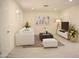 Bright and airy living room with neutral decor, stylish furniture, and ample natural light at 3208 W Bloomfield Rd, Phoenix, AZ 85029