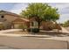 Inviting single-story home boasts well-manicured landscaping, a neutral color palette, and an attached two-car garage at 3843 E Citrine Rd, San Tan Valley, AZ 85143