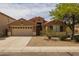 Charming single-story home with a two-car garage, desert landscaping, and a welcoming entryway at 3843 E Citrine Rd, San Tan Valley, AZ 85143
