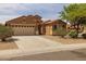 Inviting one-story home with a two-car garage, desert landscaping, and a spacious driveway at 3843 E Citrine Rd, San Tan Valley, AZ 85143