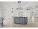 The kitchen island is the focal point of this open-concept home and features gray cabinets and modern pendant lighting at 3843 E Citrine Rd, San Tan Valley, AZ 85143