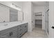 Double vanity and walk-in closet in main bathroom with a walk-in shower at 3843 E Citrine Rd, San Tan Valley, AZ 85143