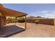 View of the backyard featuring a covered patio and low-maintenance landscaping at 3843 E Citrine Rd, San Tan Valley, AZ 85143