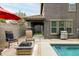Outdoor living space featuring a pool, comfortable seating, and a built-in barbecue area at 3952 E Frances Ln, Gilbert, AZ 85295