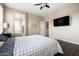 Bedroom with hardwood floors and a TV, showcasing a comfortable and modern layout at 3952 E Frances Ln, Gilbert, AZ 85295