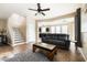 Bright living space with a staircase, view into kitchen, comfortable seating, and an open floor plan at 3952 E Frances Ln, Gilbert, AZ 85295