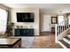 Well-lit living area showcasing a staircase, tile floors, and a seamless connection to other rooms at 3952 E Frances Ln, Gilbert, AZ 85295