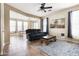 Inviting living area with tile floors, a comfortable sofa, and open access to the dining space at 3952 E Frances Ln, Gilbert, AZ 85295