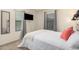 The bedroom provides a TV, plush carpeting, and a view of the front yard at 4044 S 58Th Ln, Phoenix, AZ 85043